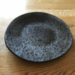 Black speckled ceramic dinner plate